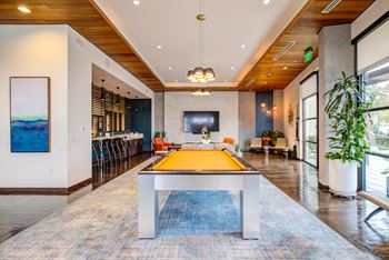 Game Room and Lounge with Billiards Table at Discovery West Apartments in  Issaquah, Washington